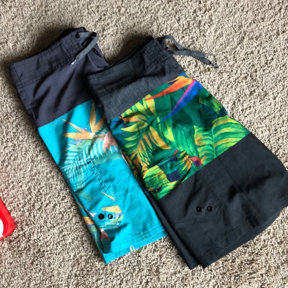2 pairs of board shorts- ocean curent size 32.
